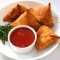 Crispy samosa served with chutney at Local Takeaway in Sydney