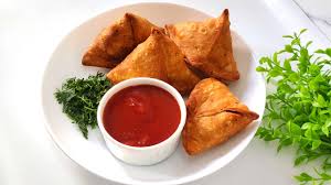 Crispy samosa served with chutney at Local Takeaway in Sydney